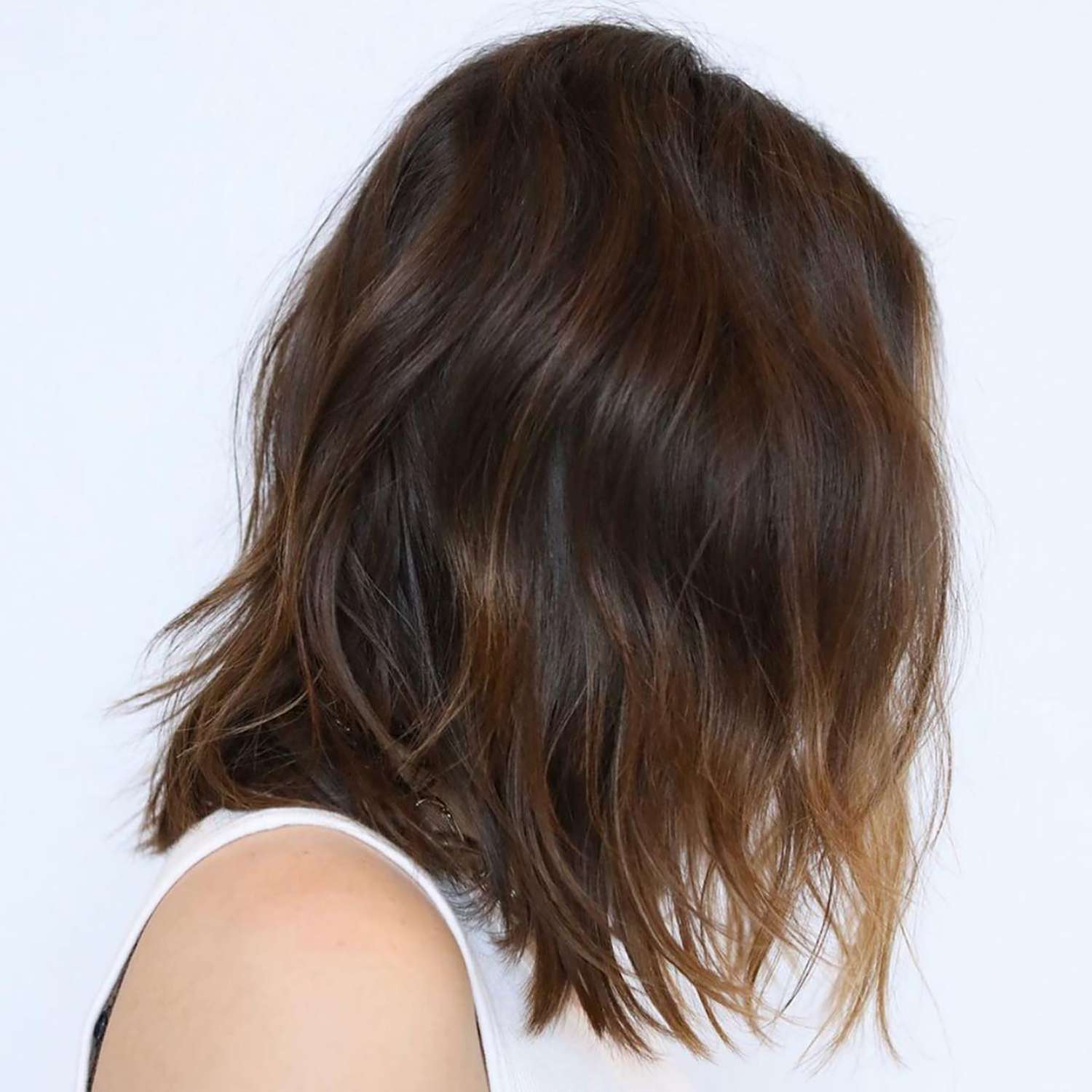 A brown, wavy, balayage lob