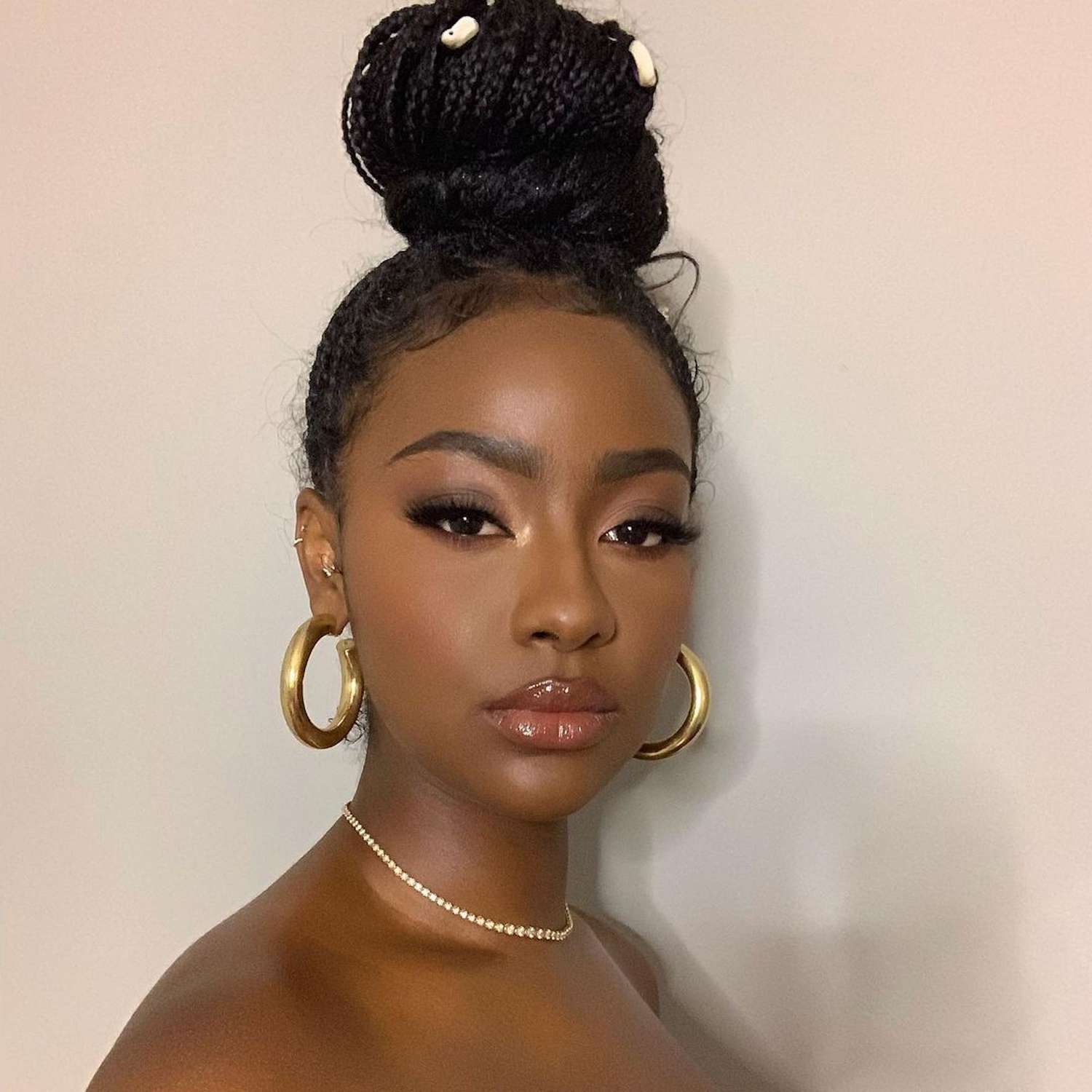 Justine Skye wears a braided topknot