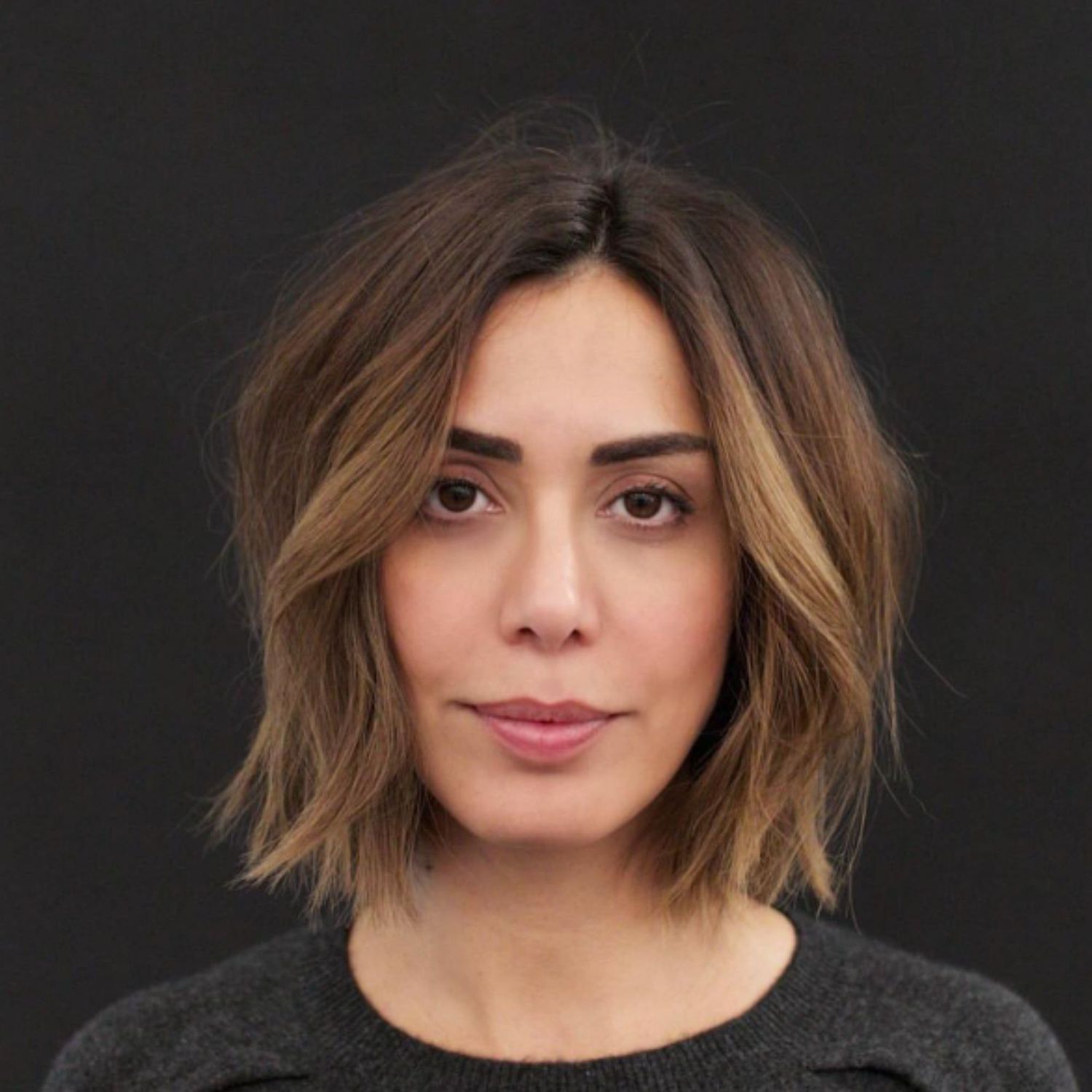 Face-framing butterscotch balayage on a bob haircut.