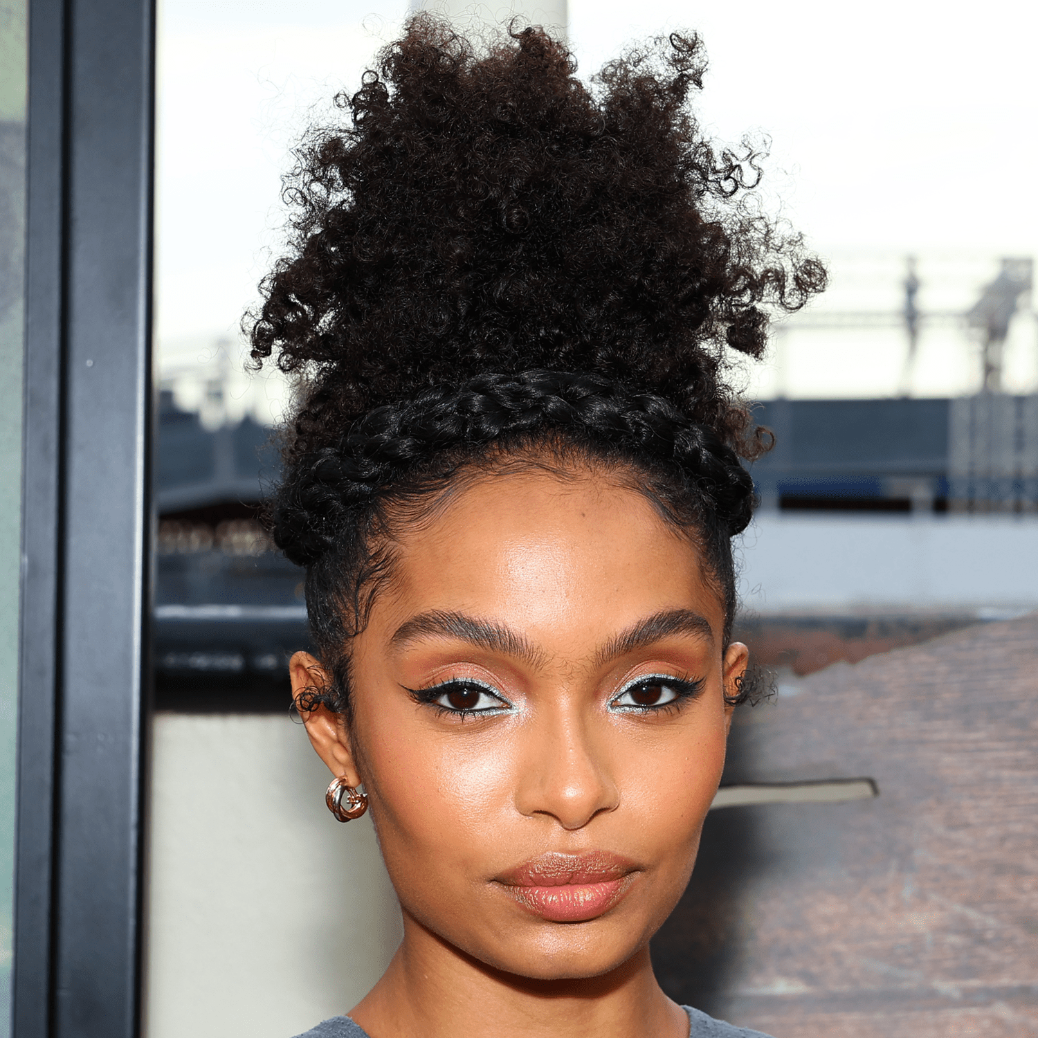 yara shahid wearing crown braid and curly hair hairstyle