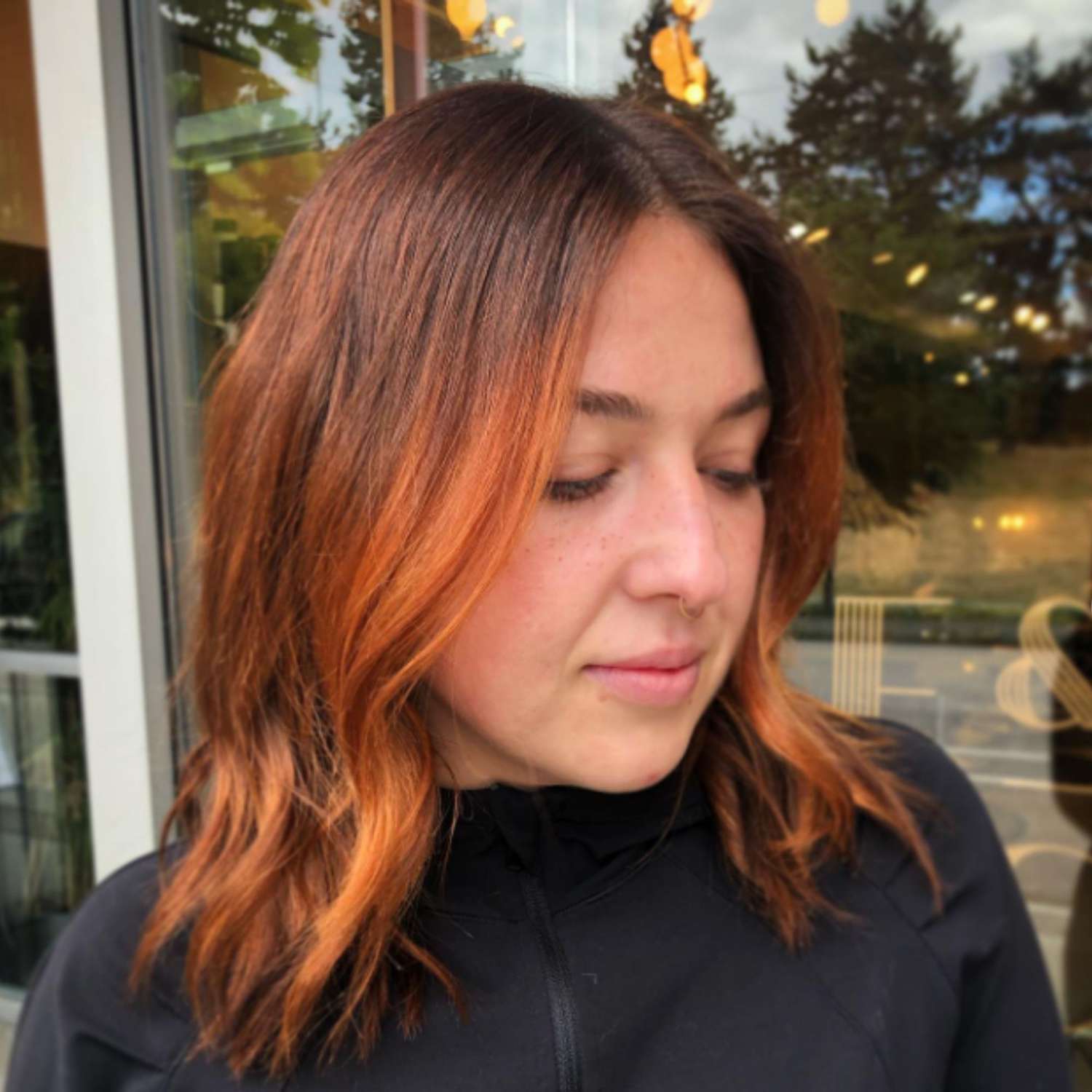 Firecracker red balayage on brown hair.