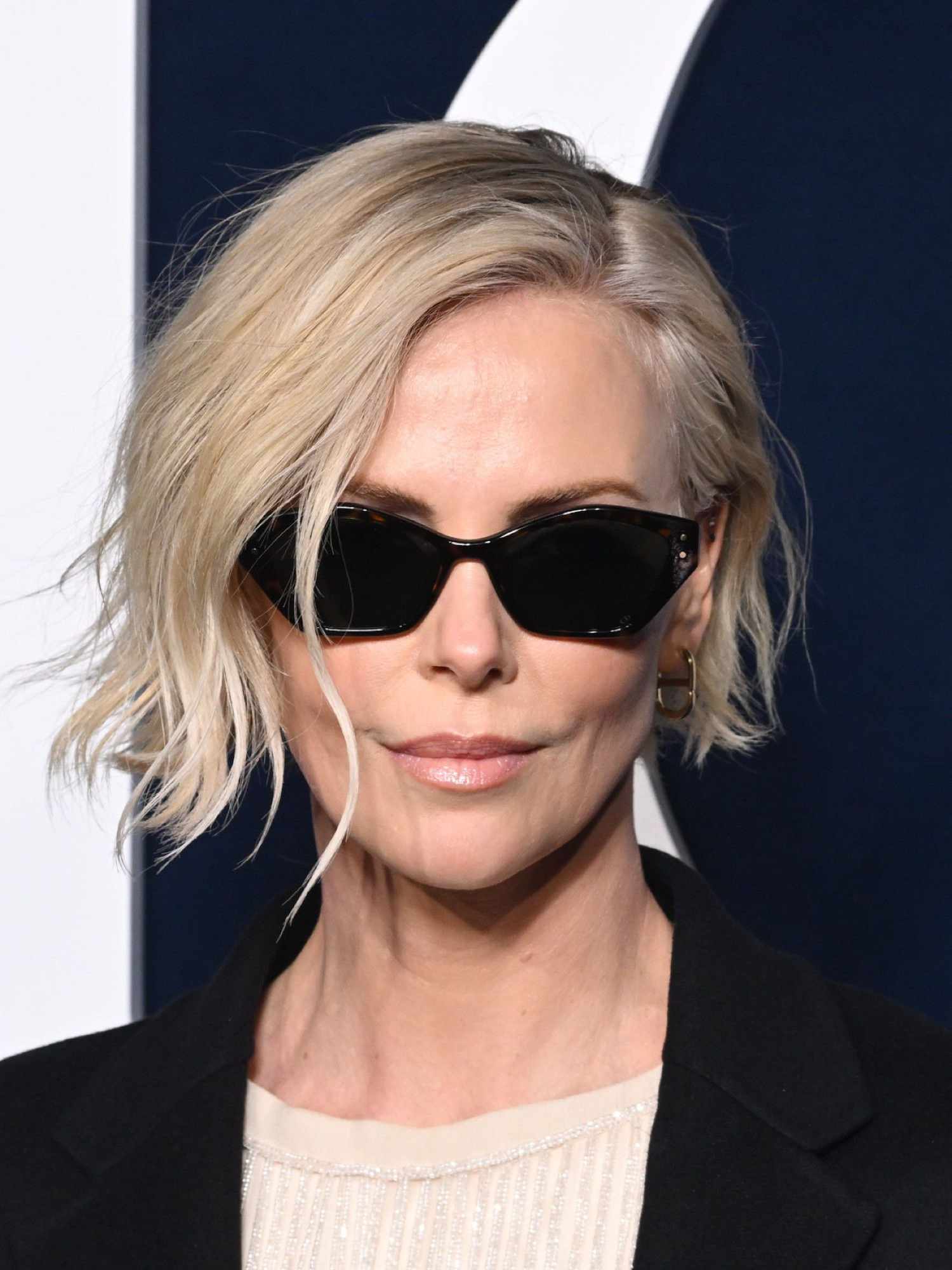 Charlize Theron with a cool girl blonde bob