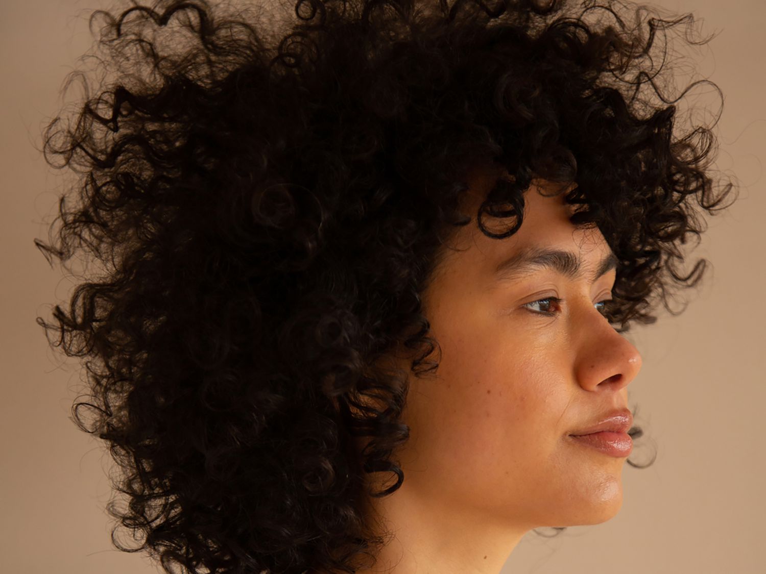 How to Grow Curly Hair Fast, According to Experts