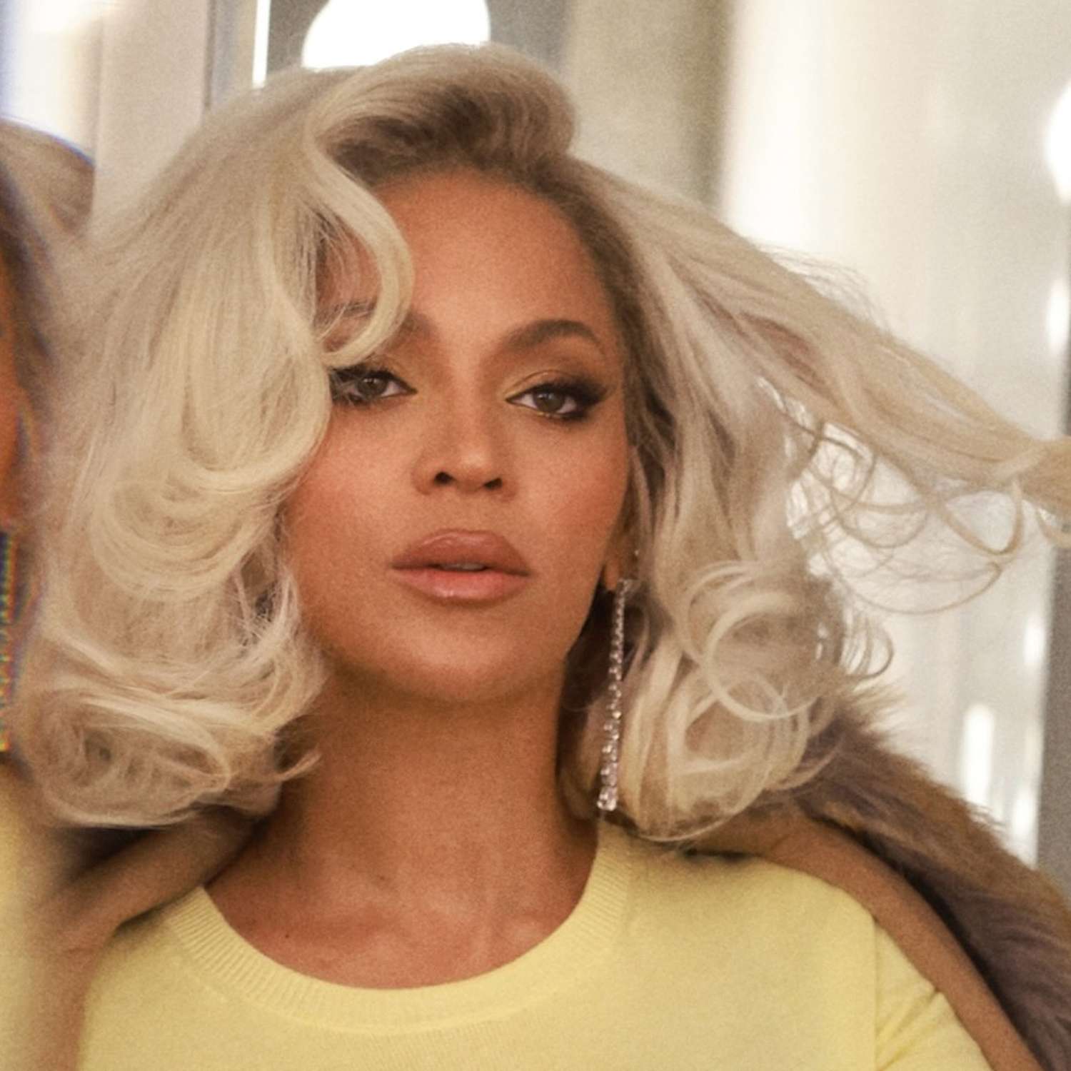 Beyonce wears a platinum bob in big bouncy Hollywood curls